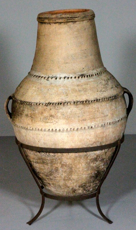 Mauritania Jar: Large jar from Mauritania on stand, low fire earthenware jug, 42"h x 18"dia. Provenance: Swampscott, MA estate.