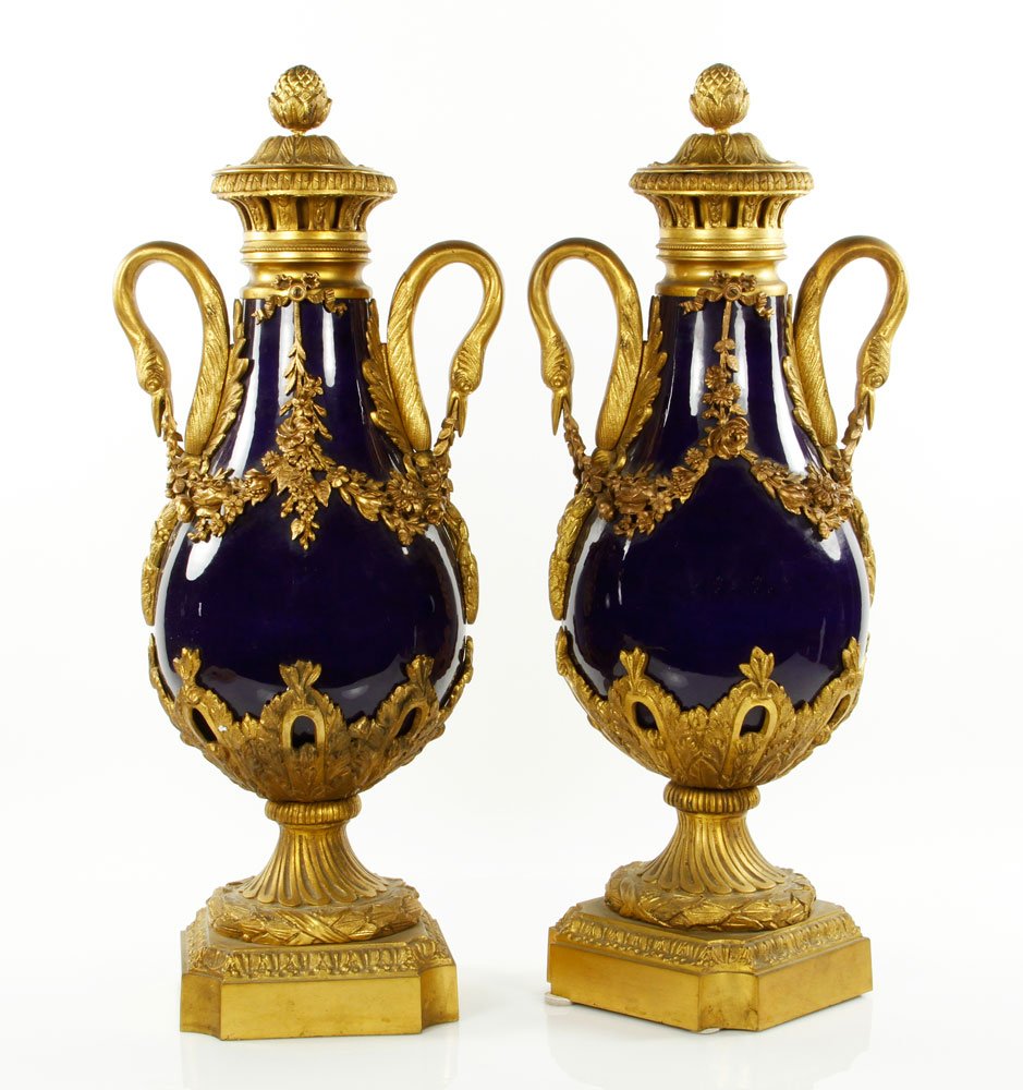 19th C. Pair of Sevres Vases: 19th century Sevres vase, cobalt blue with ormolu mounts, with top, 20 1/2" h x 8 1/2" w. Provenance: From a prominent Los Angeles collection.