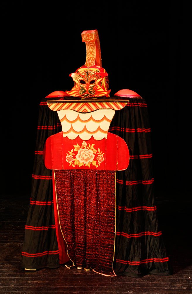 "The Vulcan" Assembled Form: "The Vulcan", hand painted papier-mâché mask, shoulder pads, and breast plate assembled on wood frame, the pieces are assembled on stage to become the Vulcan, he walks around the stage and then vani