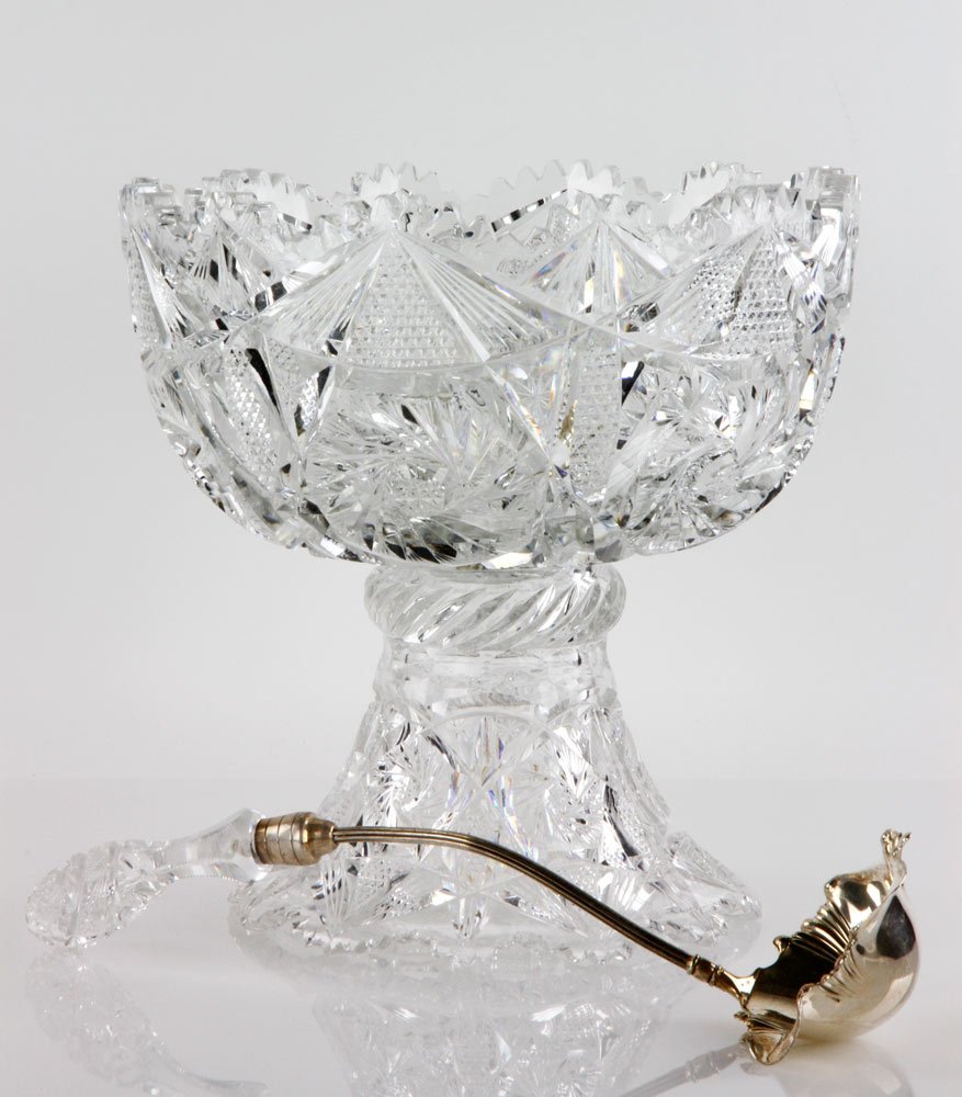 American Brilliant Period Cut Glass Punch Bowl: American punch bowl, brilliant period cut glass, on stand with conforming ladle, Pairpoint Mfg. Co. silver plate, glass most likely by Mt. Washington Glass Co., 6 5/8" h x 12" dia (bowl), 5 3/4" h (st