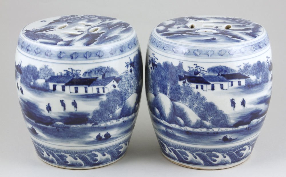 Chinese Pair of Porcelain Garden Seats: Pair of Blue and White Garden Seats, China, the miniature barrel forms each painted with a continuous landscape scene, a border of rolling waves along the base, the top similarly decorated, with a pie