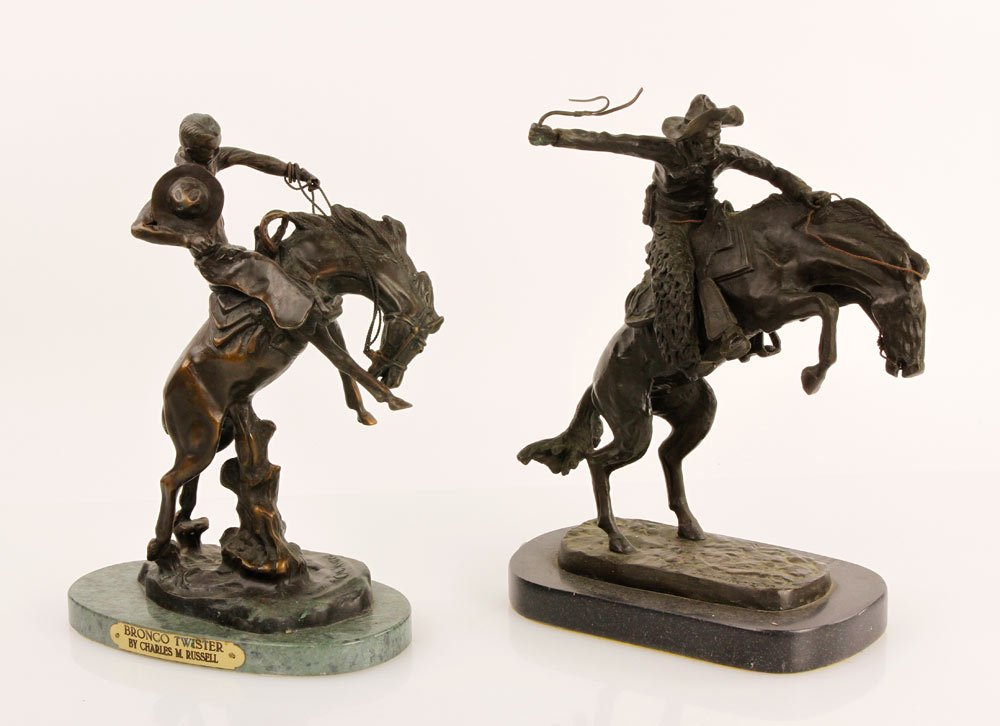 2 Remington Bronzes: Frederic Remington, lot of two "Bronco Buster" bronzes, 13"h. Provenance: CA estate.