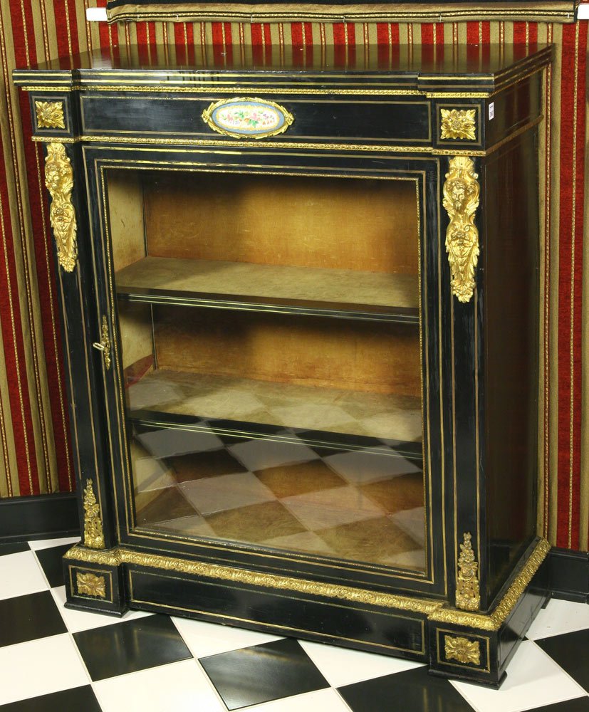 French Ebonized Wood Cabinet: French ebonized wood cabinet with ormolu decoration and sevres style plaque, 43 1/2" high x 36" wide x 15 1/4" deep, some finish wear to top.