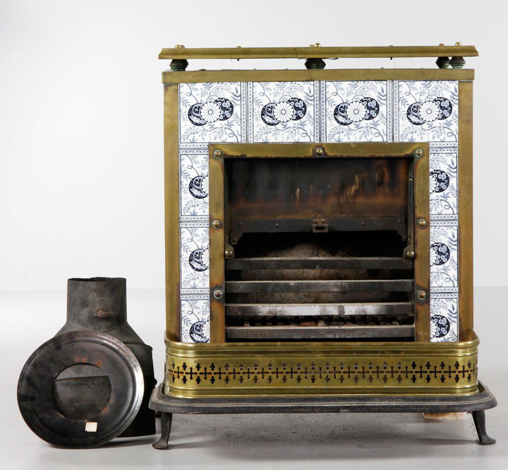 Parlor Stove: Parlor stove with tile façade, brass trim and fender. Provenance: Estate of Alexander Brook.