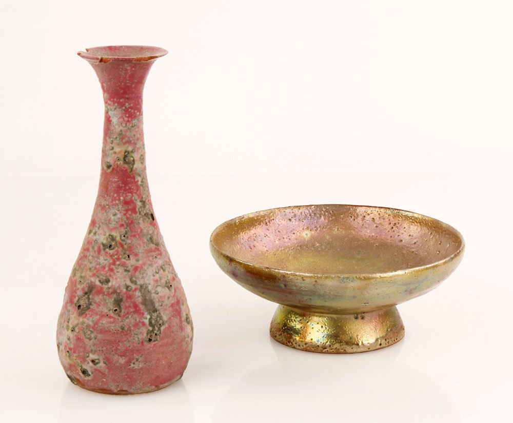 Lot of 2 Beatrice Wood Earthenware Ceramics: Lot of two Beatrice Wood ceramic pieces, including footed bowl of red earthenware with gold volcanic iridescent glaze and small bottle of red earthenware with pink volcanic glaze, both signed undersid