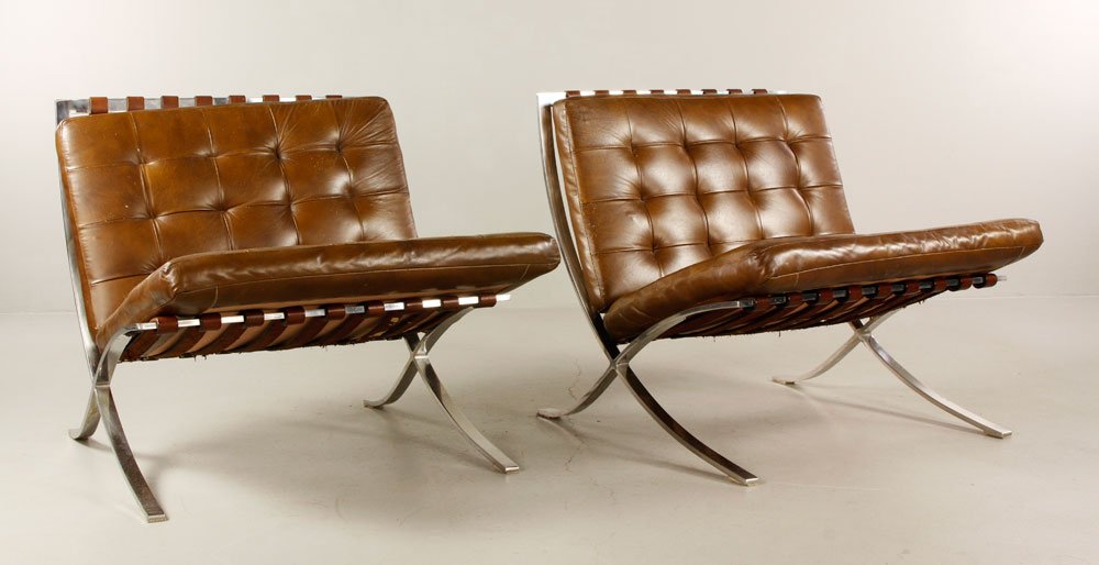 Pair of Mies van der Rohe/Knoll Barcelona Chairs: Mies van der Rohe for Knoll, pair of Barcelona chairs, chromed steel frame, reupholstered leather cushions, without original tags, circa 1950s, 30" h x 29 1/2" w x 29 1/2" d. Provenance: From a Sherbo