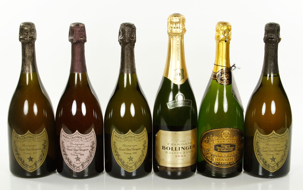 5 Bottles Champagne: Five bottles of champagne, including 1971 Lafite Reserve, 1985 Bollinger, 1988 Dom Perignon Rose, and two Dom Perignons, one from 1976 and one 1995. Provenance:From a Beacon Hill collector. Note: all