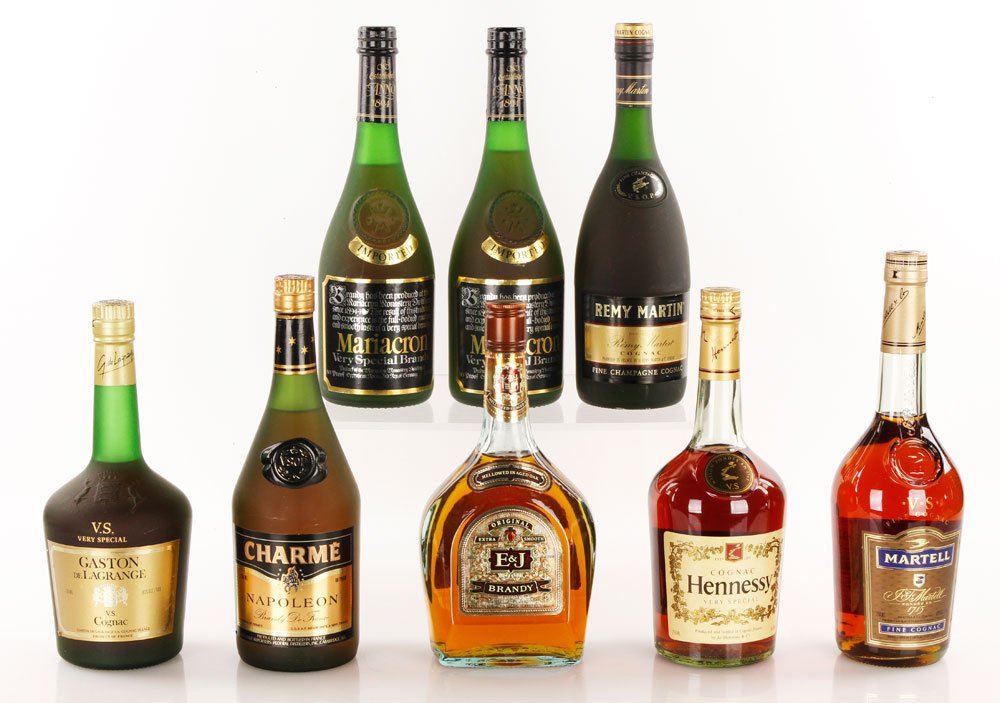 8 Assorted Brandies and Cognacs: Eight bottles of brandy and cognac, including Martell VS, Hennessy VS, Remy Martin VSOP, Gaston De Lagrange VS, Charme Napoleon, two bottles of Mariacron VS Brandy, E & J Brandy. Provenance: From a Be
