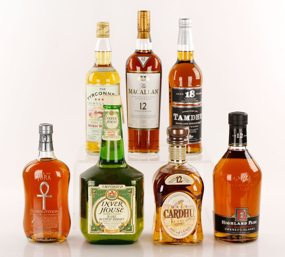 7 Bottles Scotch and Irish Whiskey: Seven bottles of single malt Scotch and Irish whiskey, and one blended whiskey, including a Macallan 12 Year, a Tamdhu 18 Year, an Orkney 12 Year, a Jura Superstition Inver House, and an Irish Tyrconn
