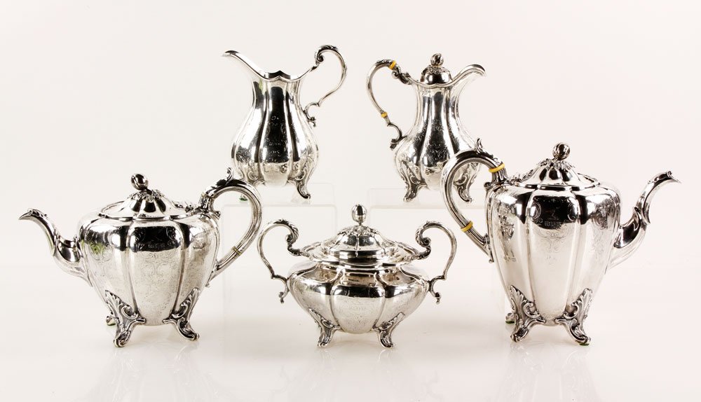 English Wilkinson and Co. Sterling Tea Service: English tea service, sterling, five pieces, Henry Wilkinson and Co., 1855-1880, all pieces hallmarked with family crest, including coffee, tea, creamer, and covered sugar bowl, approximately 76.7 troy