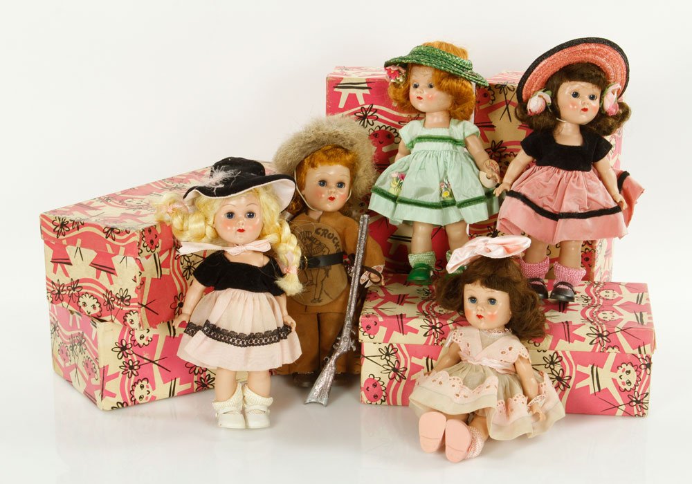 Lot of 6 Vogue Ginny Dolls: Lot of six Vogue Ginny dolls, to include: doll with pink and black dress with pink straw hat, Davy Crocket, doll with pink shorts and net skirt with flowers in hair, doll with pink lace dress with rib