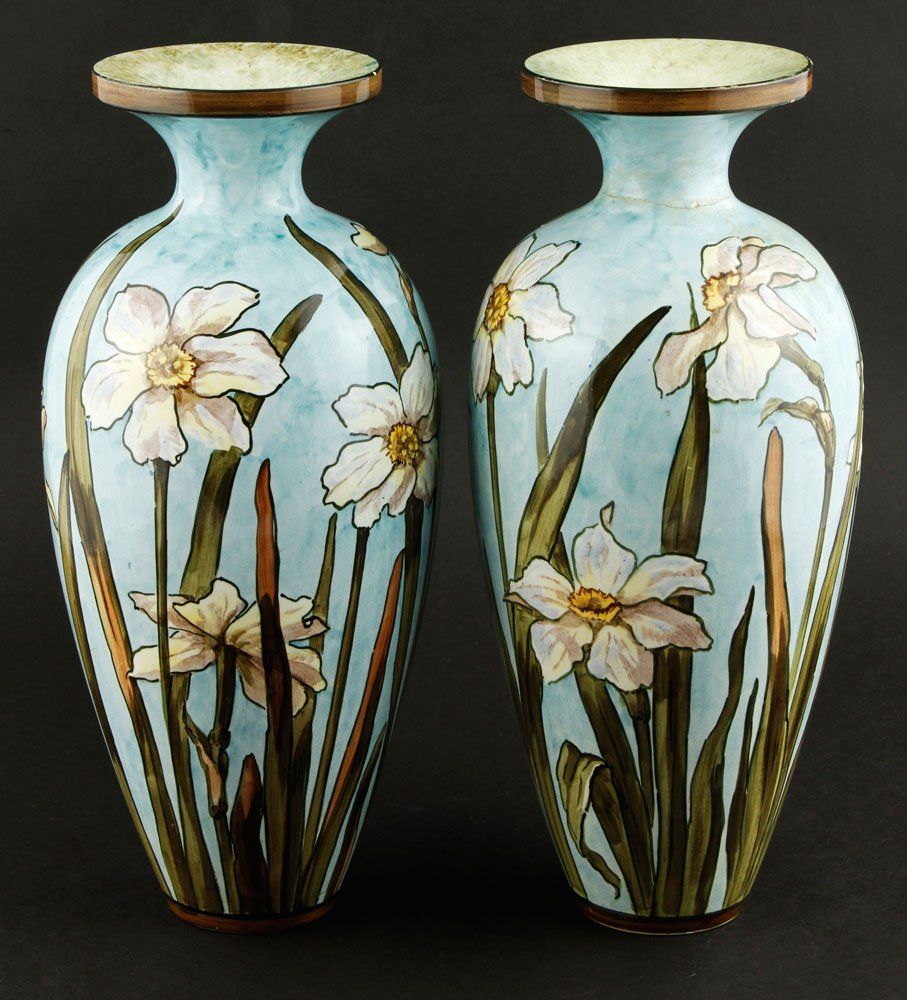 Pair of Bennett Pottery Vases: John Bennett (American 1840-1907), pair of pottery vases, hand-decorated, blue ground with white floral design, both signed in blue underglaze on underside, 11 1/4"h x 3 3/4"dia (mouth). One vase with