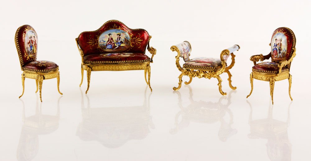 Limoges Miniature Enameled Furniture Set: Four pieces of French Limoges miniature enameled furniture, includes two settees, largest 2 3/4"h x 3"w. Provenance: From a MA estate.
