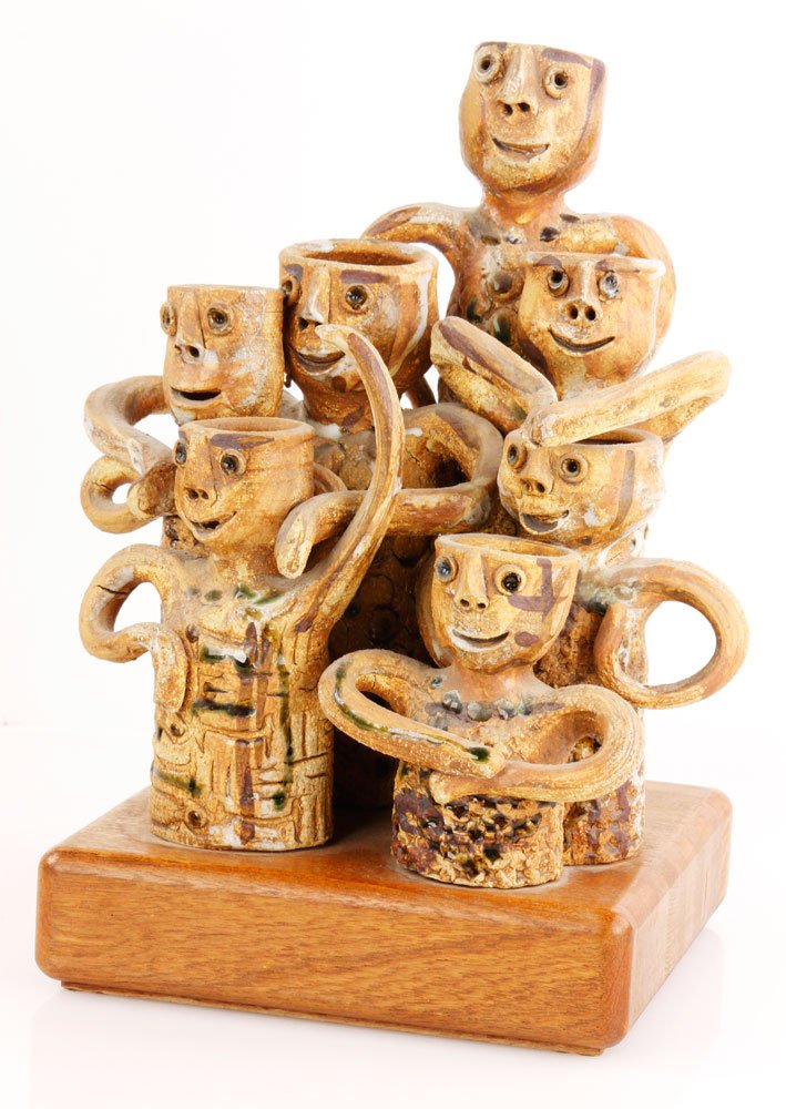 Fromhold, Group of 7 Figures, Ceramic: Hal Fromhold (American, 20th century), group of seven figures together on teak base, ceramic, signed on backside, 11" h x 10" dia, 13 1/2" h on base. Provenance: From a Santa Barbara, CA estate.