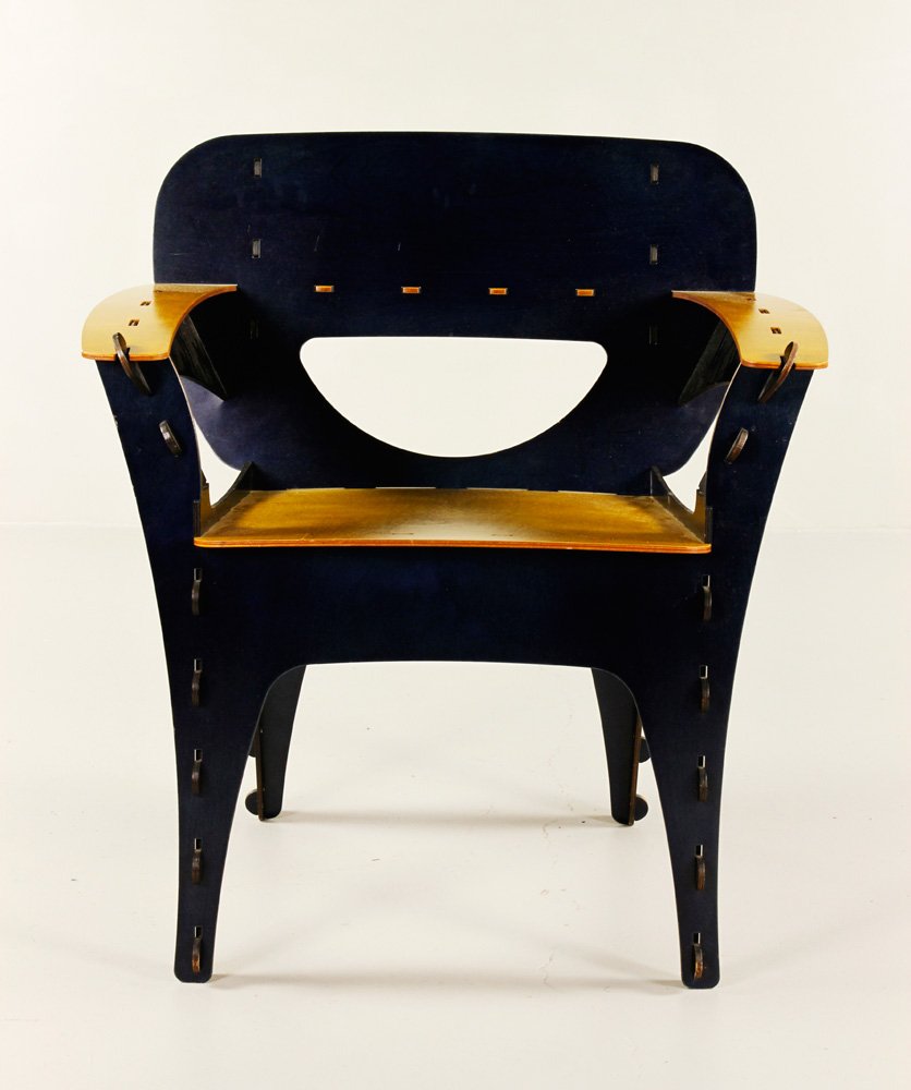 20th C. Kawecki for 3D Intentions Puzzle Chair: David Kawecki for 3D Intentions puzzle chair, laminated birch, blue and yellow stain, 33" h x 30" w x 24" d. Provenance: From a California estate.