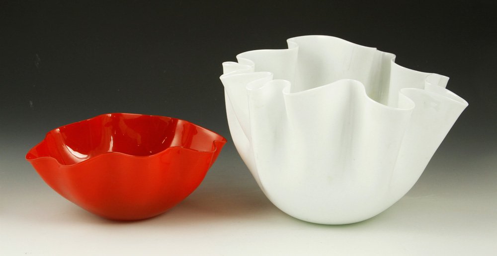 Lot of 2 Pieces of Art Glass: Lot of two pieces of scalloped art glass, one white bowl marked Venini, Italia underside, and one red bowl signed "Orrefors S. Palmquist" underside, white bowl 6 1/2" h x 9" dia, red bowl 3 1/2" h x 8