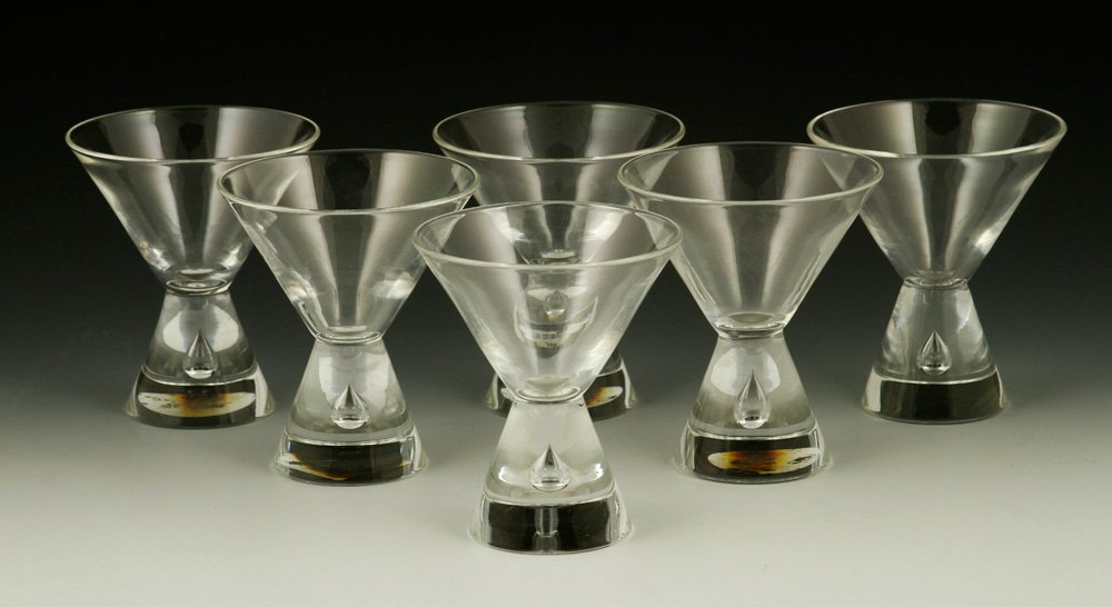 Lot of 6 Steuben Martini Glasses: Lot of six Steuben teardrop martini glasses, 4" h x 3 3/8" dia. Provenance: From a Florida estate.