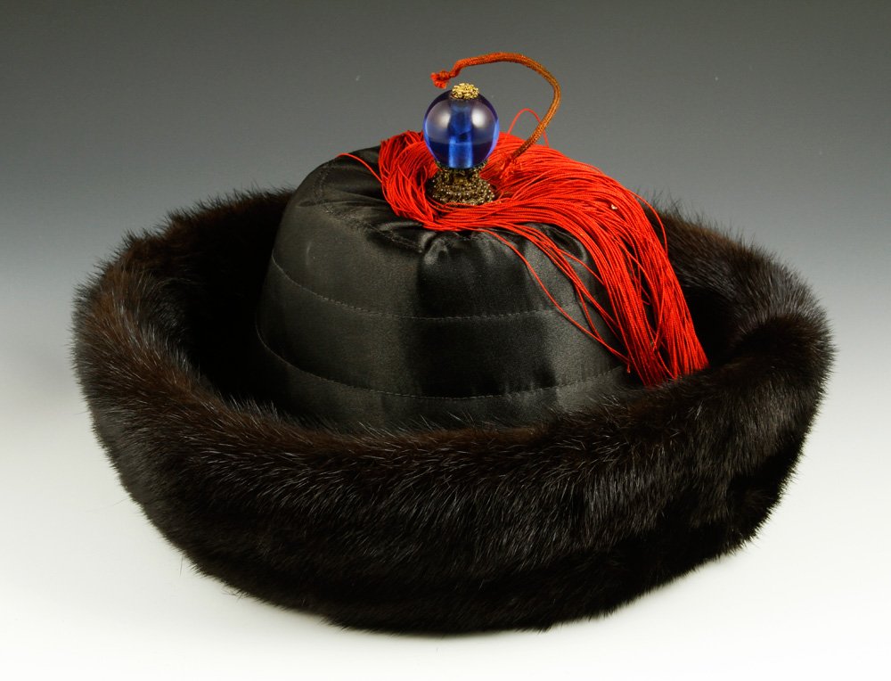Chinese Manchurian Hat: Manchurian hat, China, late 19th century, mink fur with blue Peking glass finial, 7"h x 11 1/2"w.