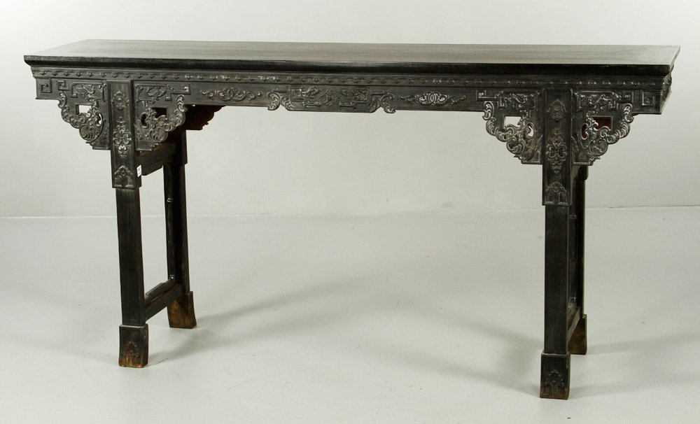 Chinese Zitan Wood Altar Table: Zitan wood altar table, China, Qing Dynasty, sides delicately carved, with cloud shaped spandrels, 33 1/2"h x 66"w x 15 3/4"d.