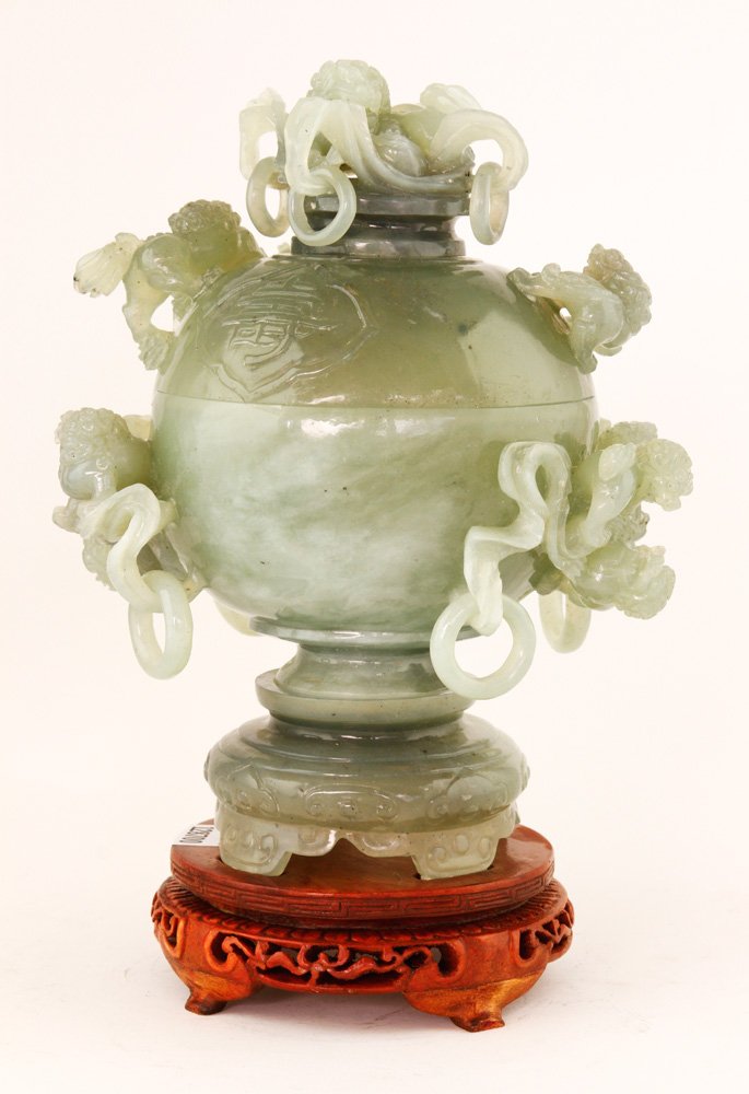 Chinese Jade Covered Jar: Jade covered jar, China, with foo dogs and loose ring handles, with stand, 9" h. Provenance: From the estate of the late Raymond Bolduc of Fort Lauderdale, Florida and Ogunquit, Maine.