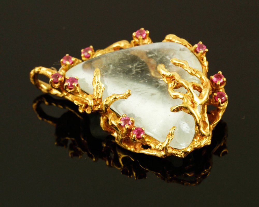 18K Gold, Ruby and Aqua Pendant: 18K yellow gold pendant with ruby and aqua nugget, Arthur King designer, approximately 24 g. TW, 1 3/4" x 1 1/8". Provenance: MA estate.
