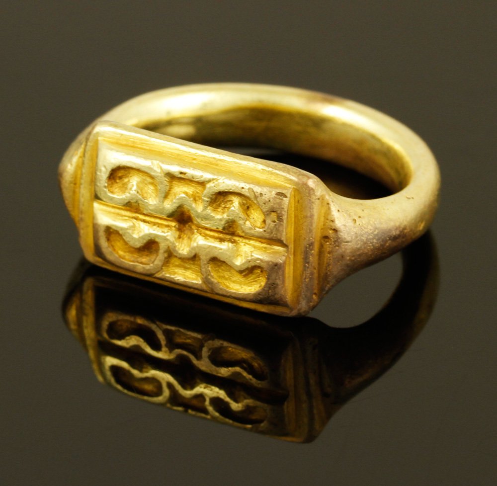20-22K Indonesian Ring: 20-22K Indonesian gold ring with seal design, 5th century, 18 g. TW. Provenance: NY estate.