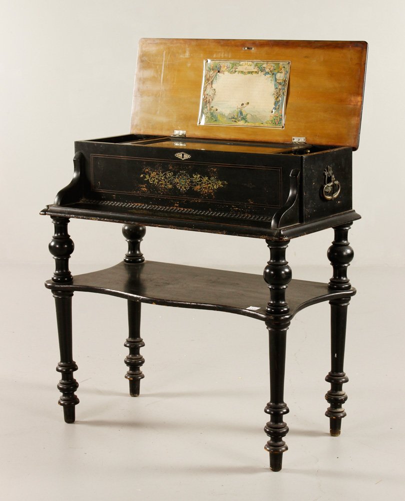 Music Box on Stand: Music box on stand, ebonized wood, 12 tune, 30 1/4" h x 28 1/2" w x 16" d. Provenance: IL estate.