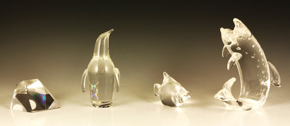 4 Steuben Paperweights: Two Steuben fish, one penguin, one prism, glass, 8" h (fish). Provenance: MA estate.