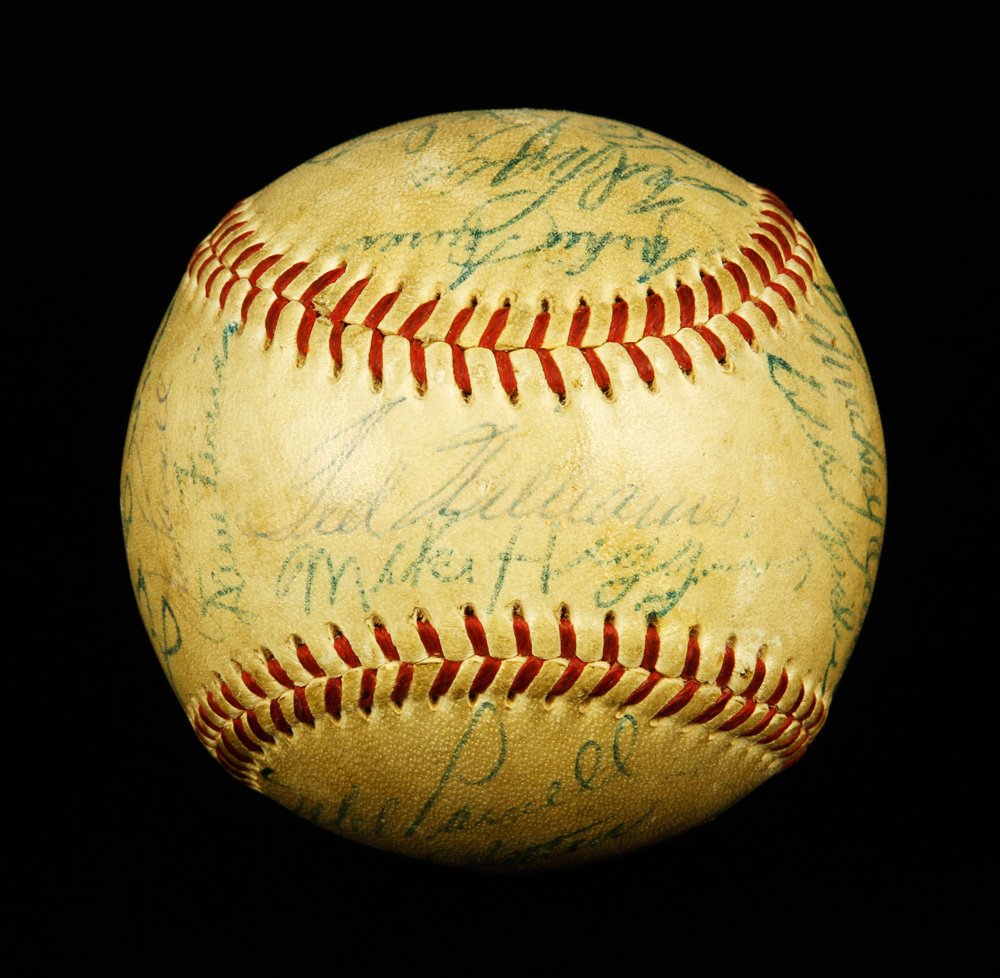 Ted Williams Signed Baseball: Baseball signed by Ted Williams (sweet spot) and many other Red Sox players and coaches, including Mel Parnell, Jim Piersall, and Mike Higgins, circa 1950s. Provenance: MA estate.