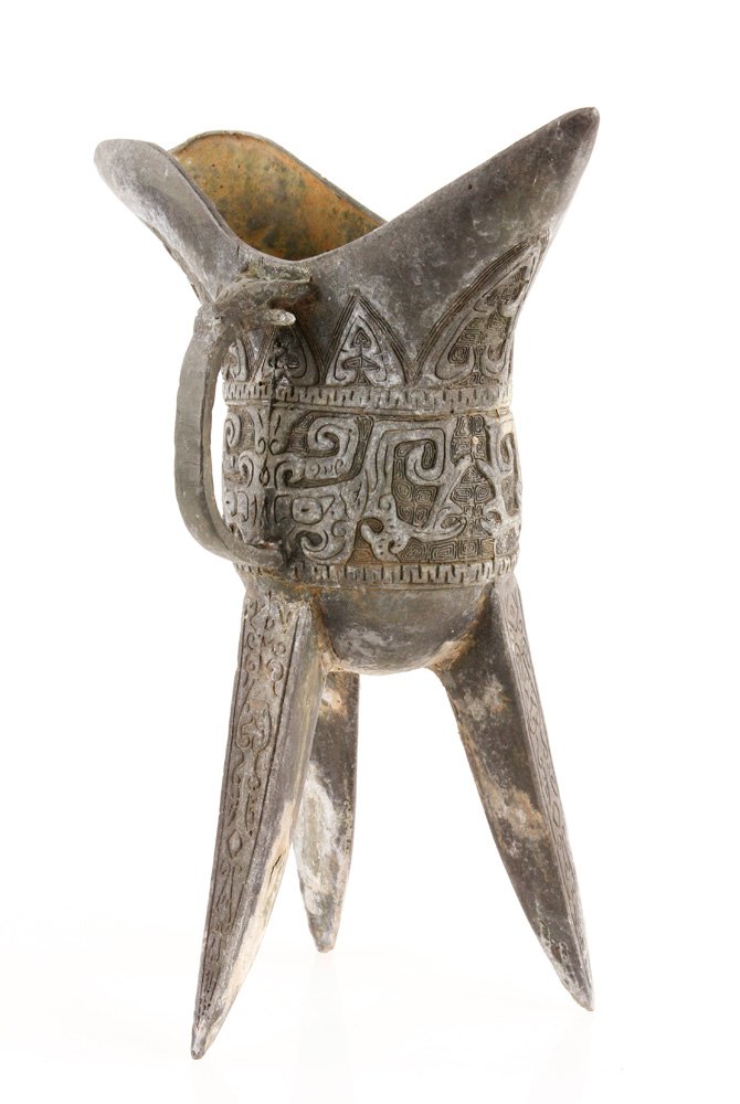 Chinese Archaic Form Wine Cup: Chinese archaic form wine cup on three legs, 12" h x 9" w. Provenance: From a California collection.