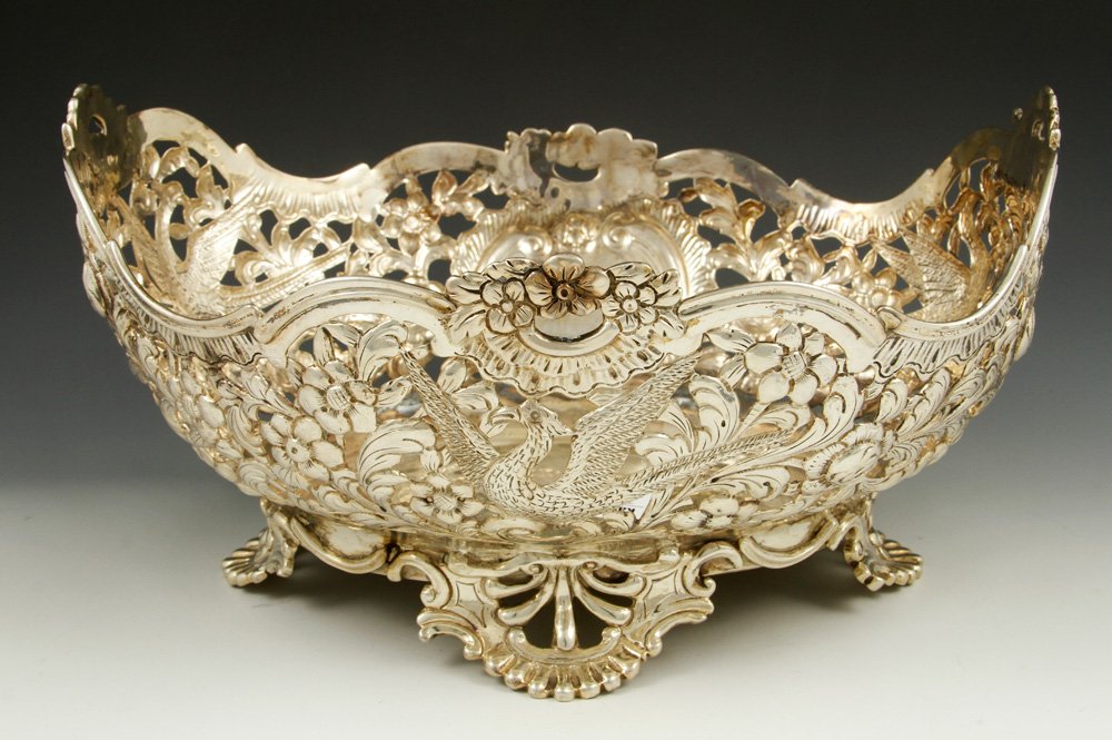 Sterling Silver Centerpiece: Centerpiece, sterling silver, with foliate pierced design and phoenix birds, hallmarked for London 1897-1898, 5 3/4"h x 11 3/4"w x 9 1/4"d, approximately 34.7 troy oz TW. Provenance: From a Massachuse
