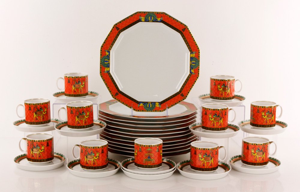 Rosenthal Versace Collection Dinnerware: Rosenthal Versace Collection dinnerware, "Marco Polo's Journey" pattern, to include: eleven tea cups, 2 3/4" h x 2 3/4" dia; twelve saucers, 5 3/8" dia and twelve dinner plates, 11" dia. Provenance: F