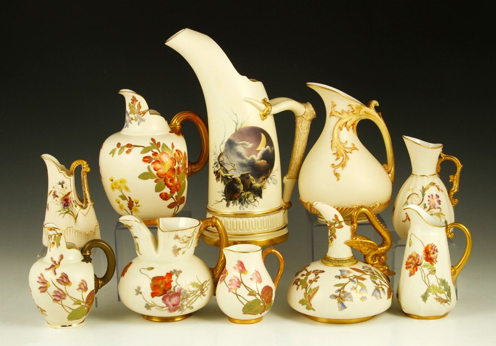 Collection of 10 Royal Worcester Ewers and Pitchers: Collection of ten Royal Worcester blush ivory ewers and pitchers, one with hand painted night sky with birds, porcelain, all with puce marks, tallest 11 1/4" h, smallest 3 3/4" h. Provenance: From a N