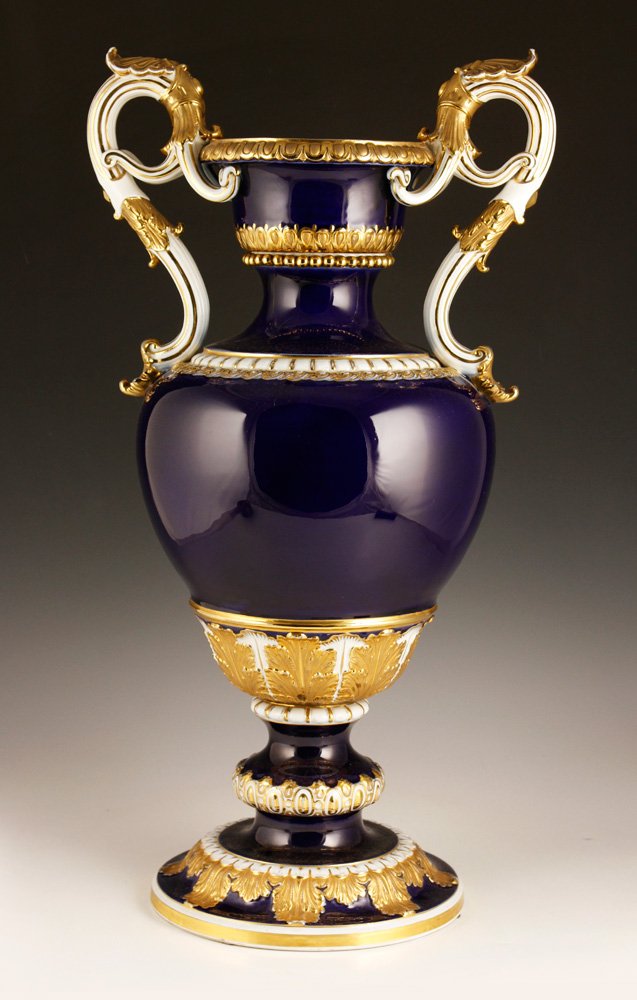 19th C. Meissen Urn: 19th century Meissen urn, cobalt with white and gold accents, under glaze cross swords mark as well as paper label for "Gilman Collamore & Co. 5th Ave NY," 24 1/4" h. Provenance: From a NY estate.