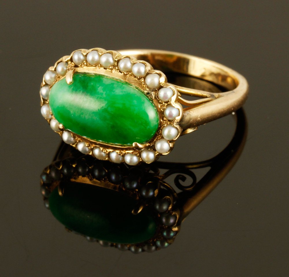 14K Seed Pearl and Cabochon Jade Ring: 14K yellow gold, seed pearl, and cabochon jade ring, approximately 4 g. TW, size 6 3/4. Provenance: From a NY collection.