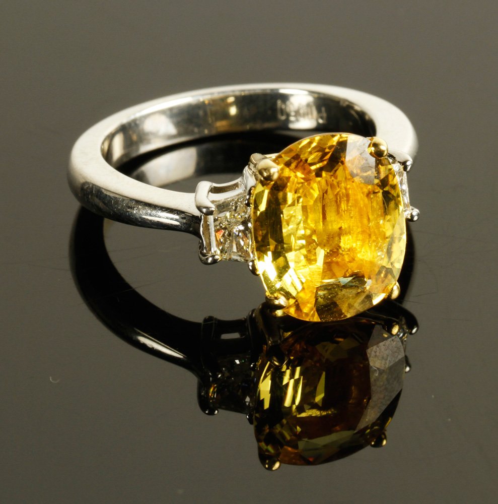 Platinum Diamond and Yellow Sapphire Ring: Platinum, diamond, and yellow sapphire ring, sapphire approximately 12.0 x 10.0 mm, approximately 10 g. TW, size 7 1/4. Provenance: From a NY collection.