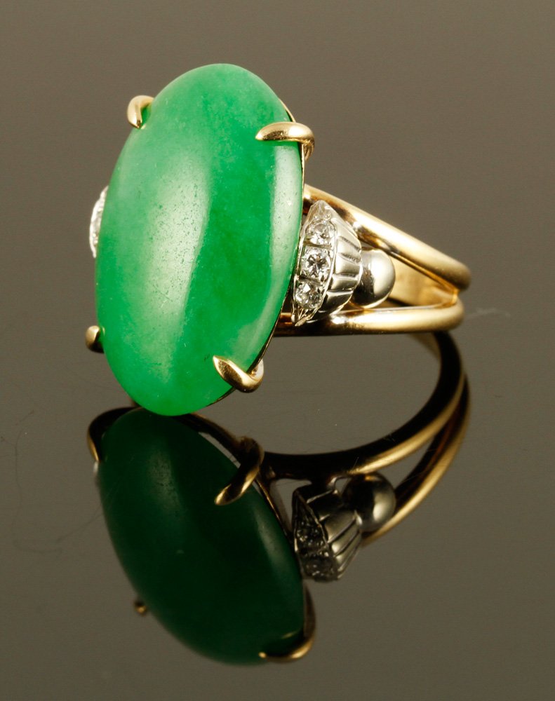 14K Diamond and Jade Ring: 14K yellow gold, diamond, and jade ring, approximately 7 g. TW, size 7. Includes GIA report. Provenance: From a NY collection.