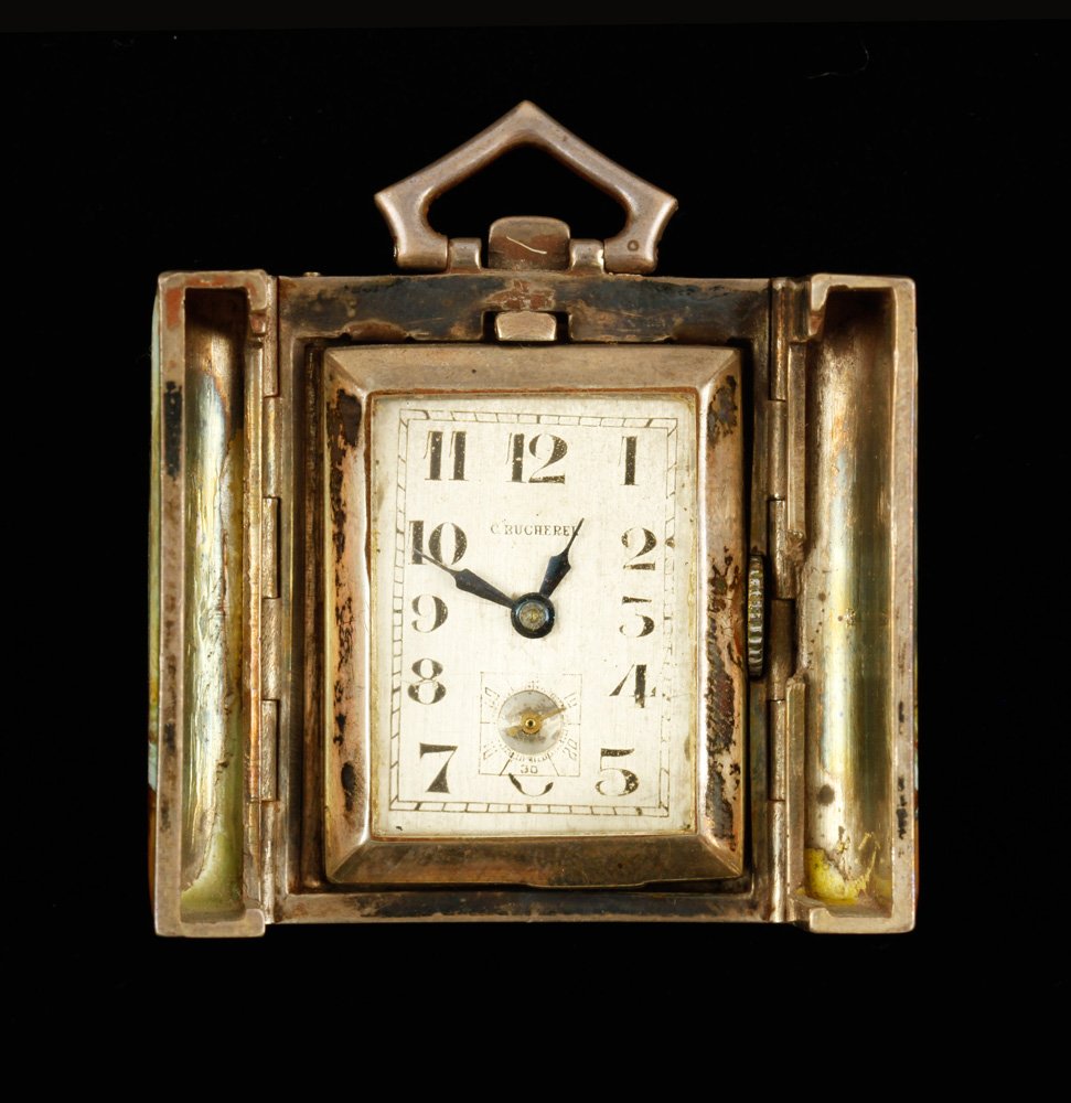 C. Bucherer Watch: C. Bucherer watch in guilloche enameled sterling travel pendant case, approximately 1.5 troy oz. TW, 1 1/4" l x 1 1/8" w. Provenance: From a ME estate.