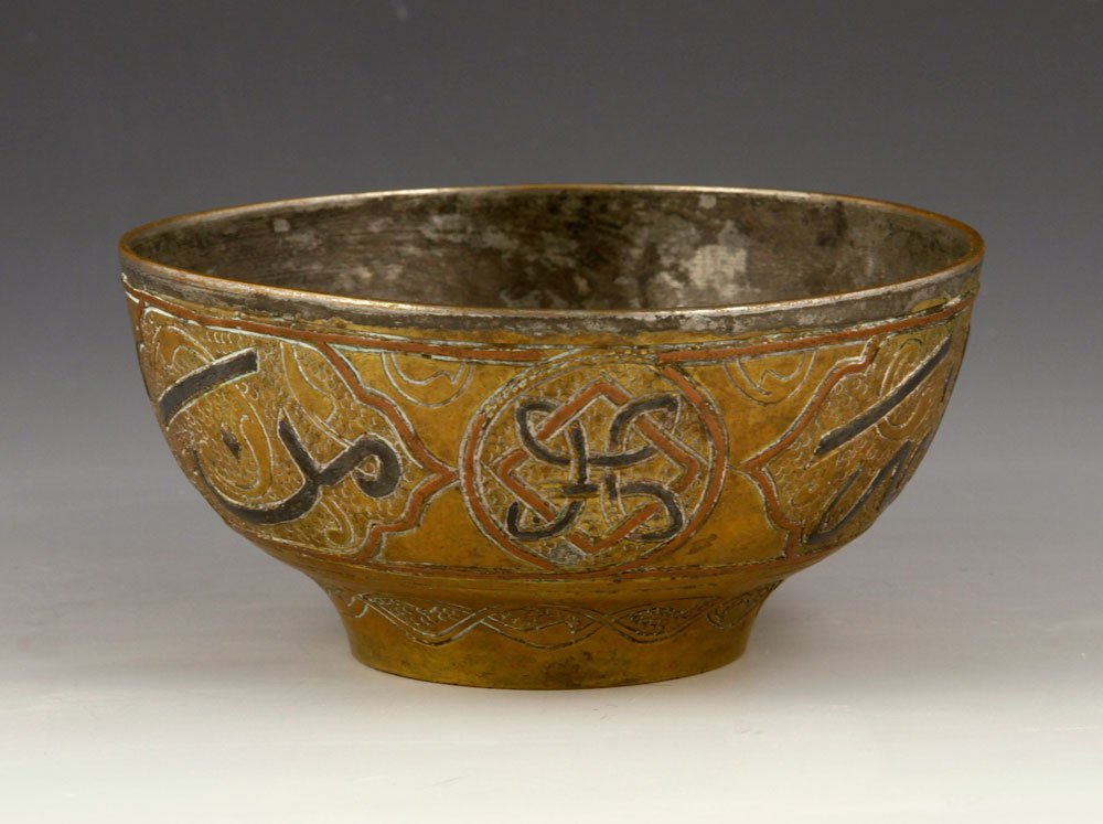 19th C. Brass Bowl: 19th century bowl, brass, with silver Islamic script inlay, 2"h x 4 1/4"dia. Provenance: From a Massachusetts collector.