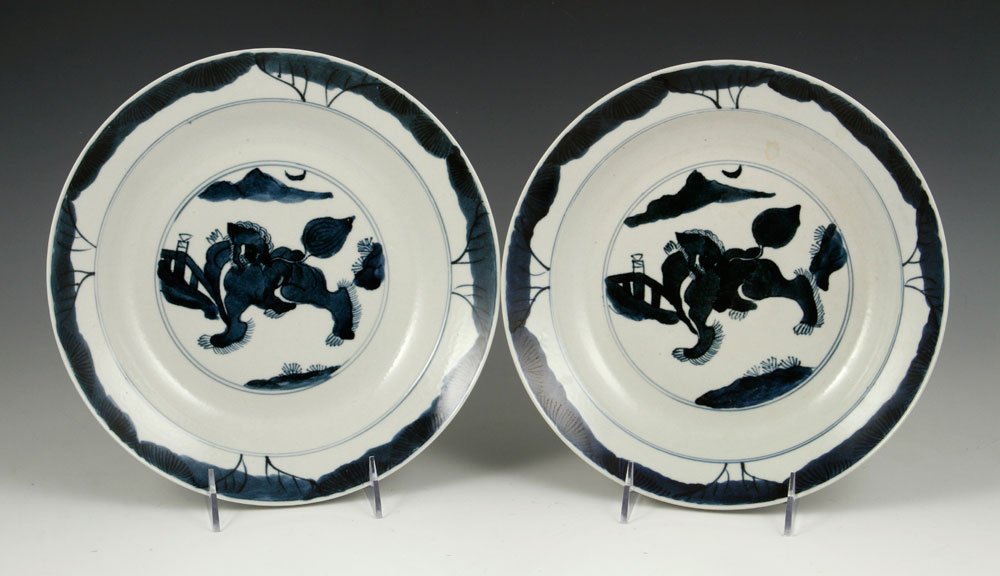 Pr. Chinese Blue and White Plates: Pair of Chinese blue and white plates, porcelain, Ming Dynasty, decorated with foo lion and mountain, marked on base, 10"dia. Provenance: From a California estate.