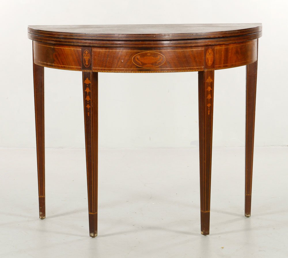 20th C. Hepplewhite Mahogany Card Table: Early 20th century custom Hepplewhite demilune card table, mahogany, with bellflower inlay, 30"h x 36"w x 18"d closed, 36"dia open. Provenance: From a Massachusetts collector.