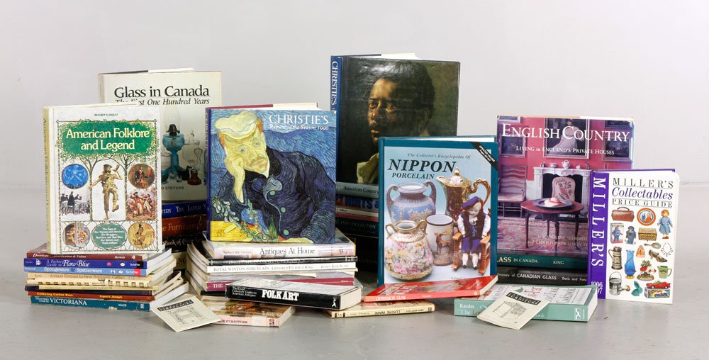 Large Collection of Art Reference Books: Large collection of antique and decorative arts reference books, approximately 40 total, mostly hardcover, covering Christie's annual reviews, Canadian glass and furniture, Shelley, Clarice Cliff "Biz
