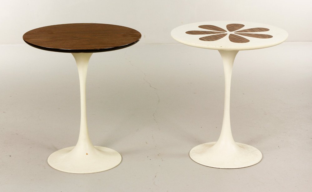 Pair of Circular End Tables: Pair of end tables, in the style of Eero Saarinen, each with circular laminate top, over fluted base with circular foot, one having a floral design across the top, each 20" h x 17 3/4" dia. Provenance