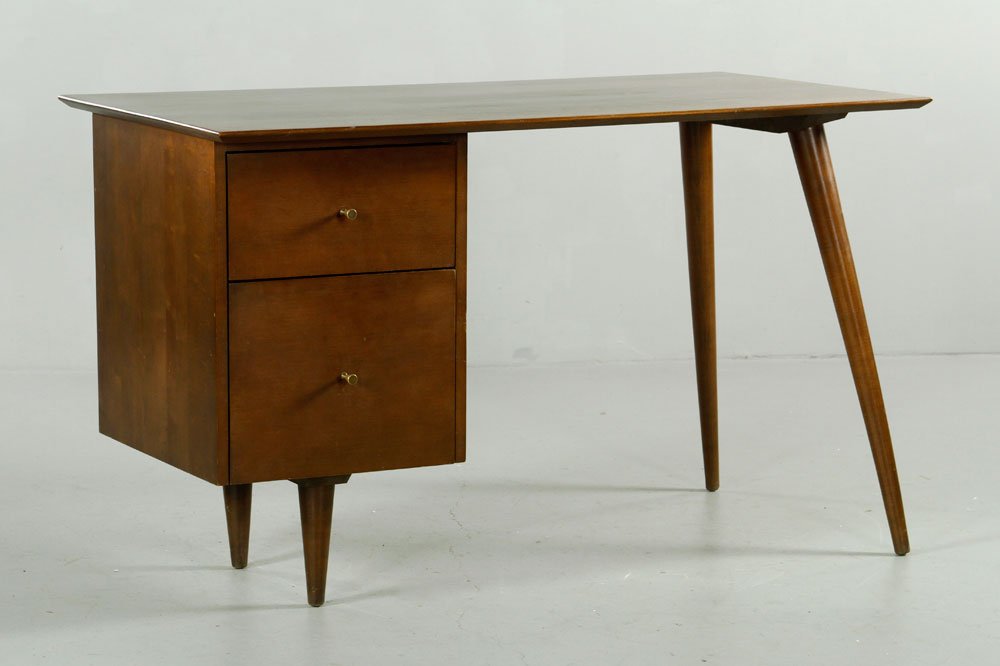 McCobb Planner Group Desk: Paul McCobb planner group desk by Winchendon, original finish, brass drawer pulls, 29 1/4" x 48" x 24". Provenance: From a MA estate.