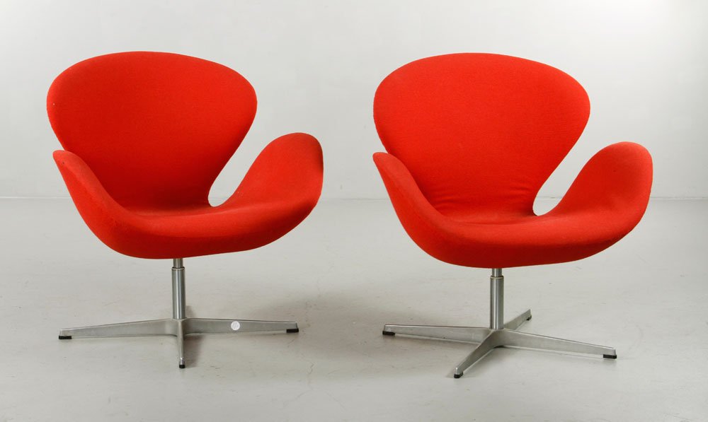 Pr. Jacobsen for Hansen Swan Chairs: Pair of Arne Jacobsen for Fritz Hansen swan chairs, both with original label, aluminum base, original red upholstery, circa 1985, 30 3/4" x 30" x 21". Provenance: From a MA estate.