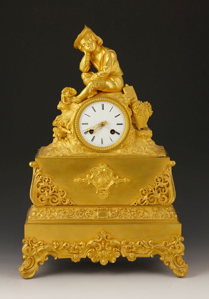 19th C. French Mantel Clock: 19th century French mantel clock, lemon gilt over bronze, with key, 17" h x 12" w x 4 3/4" d. Provenance: From the Estate of Mary L. Alchian, Palm Springs, CA.