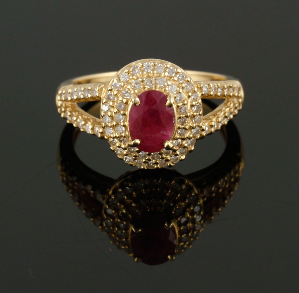 14K Diamond and Ruby Ring: 14K yellow gold, diamond, and ruby ring, numerous round brilliants, ruby approximately 5 x 7 mm, approximately 5 g. TW, size 7 1/4. Provenance: From a Massachusetts estate.