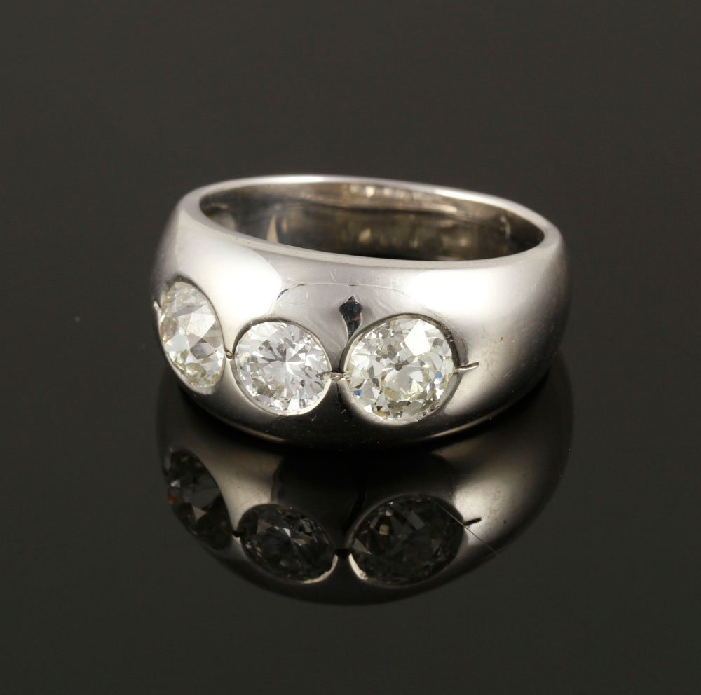 Men's 14K 3-Stone Diamond Ring: Men's 14K white gold, three-stone diamond ring, diamonds approximately 1.25 cts., 1.12 cts., and 0.65 cts., approximately 11 g. TW, size 10 1/2. Includes appraisal certificate. Provenance: From the Es