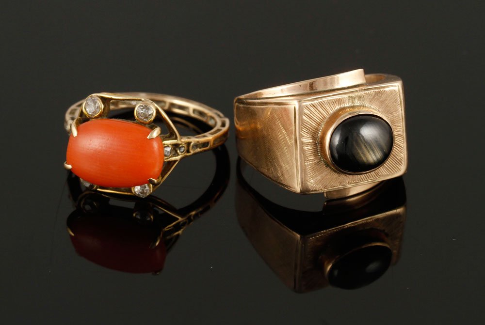 Lot of 2 Ladies' 14K Rings: Lot of two ladies' 14K gold rings, to include: one diamond and coral ring, approximately 2.9 g. TW, size 5 1/2 and one blue star sapphire ring, approximately 4.4 g. TW, size 6 3/4. Provenance: From th