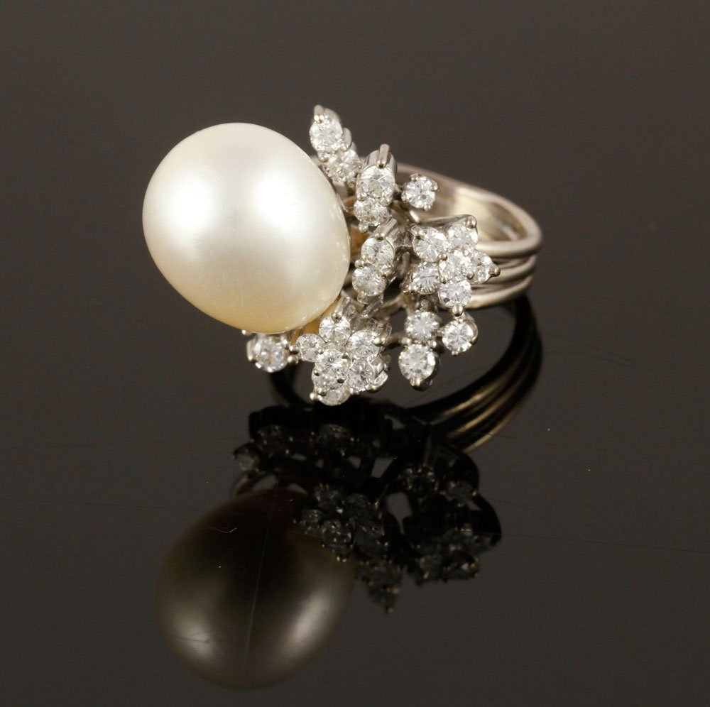 Ladies' 14K Diamond and Pearl Ring: Ladies' 14K white gold, diamond and pearl ring, twenty-seven round brilliant cut diamonds approximately .85 CTW, pearl approximately 14.9- 11.7 mm, approximately 8.80 g. TW, size 5. Includes appraisal